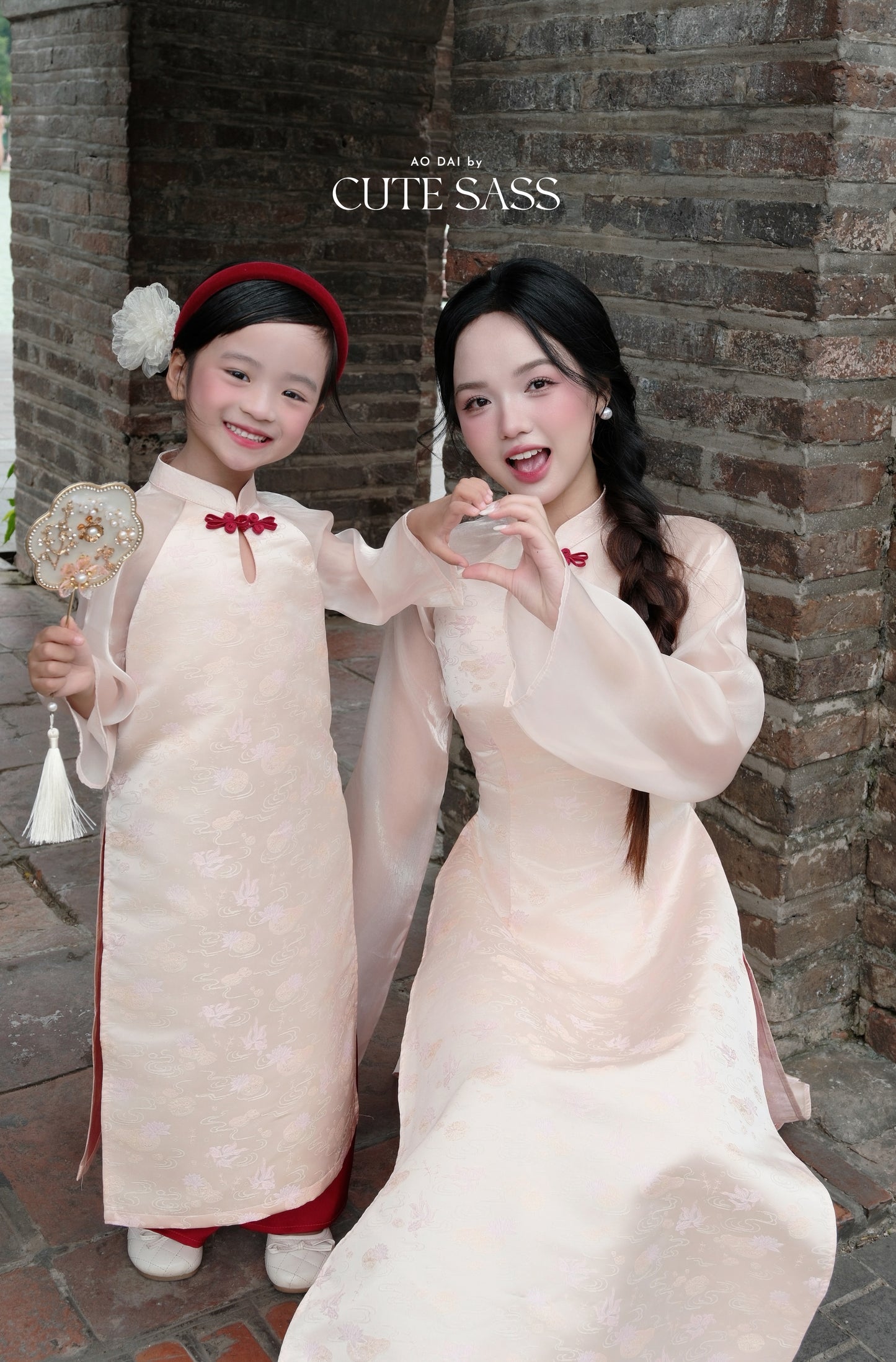 Linh Vy - Mom and Daughter Haze Cream Teardrop Cutout Red Knot Ao Dai Set