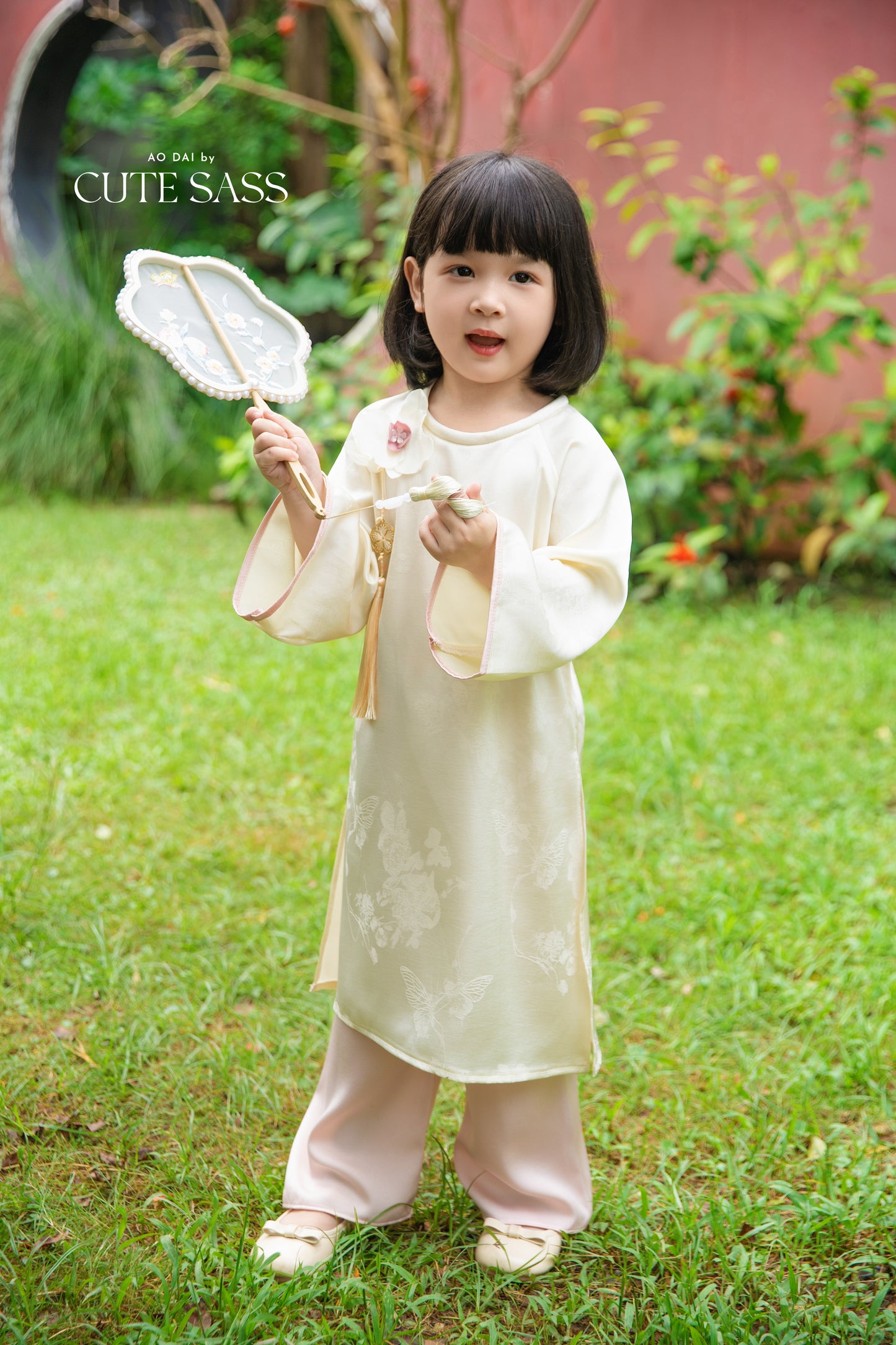 Gia Hòa - Mom and Daughter Cream with Hibiscus Flower Pin Ao Dai Set