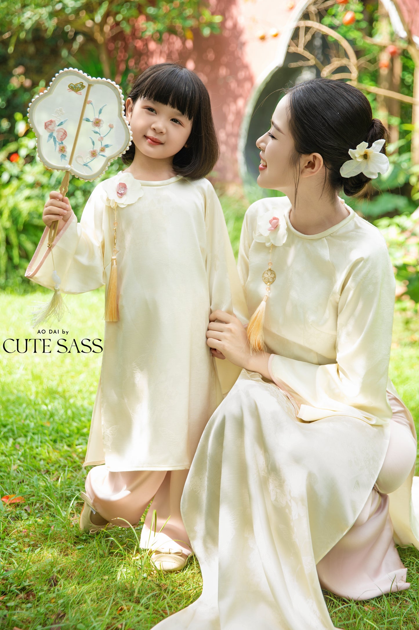 Gia Hòa - Mom and Daughter Cream with Hibiscus Flower Pin Ao Dai Set