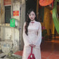 Linh Vy - Haze Cream Teardrop Cutout Red Knot Ao Dai Set
